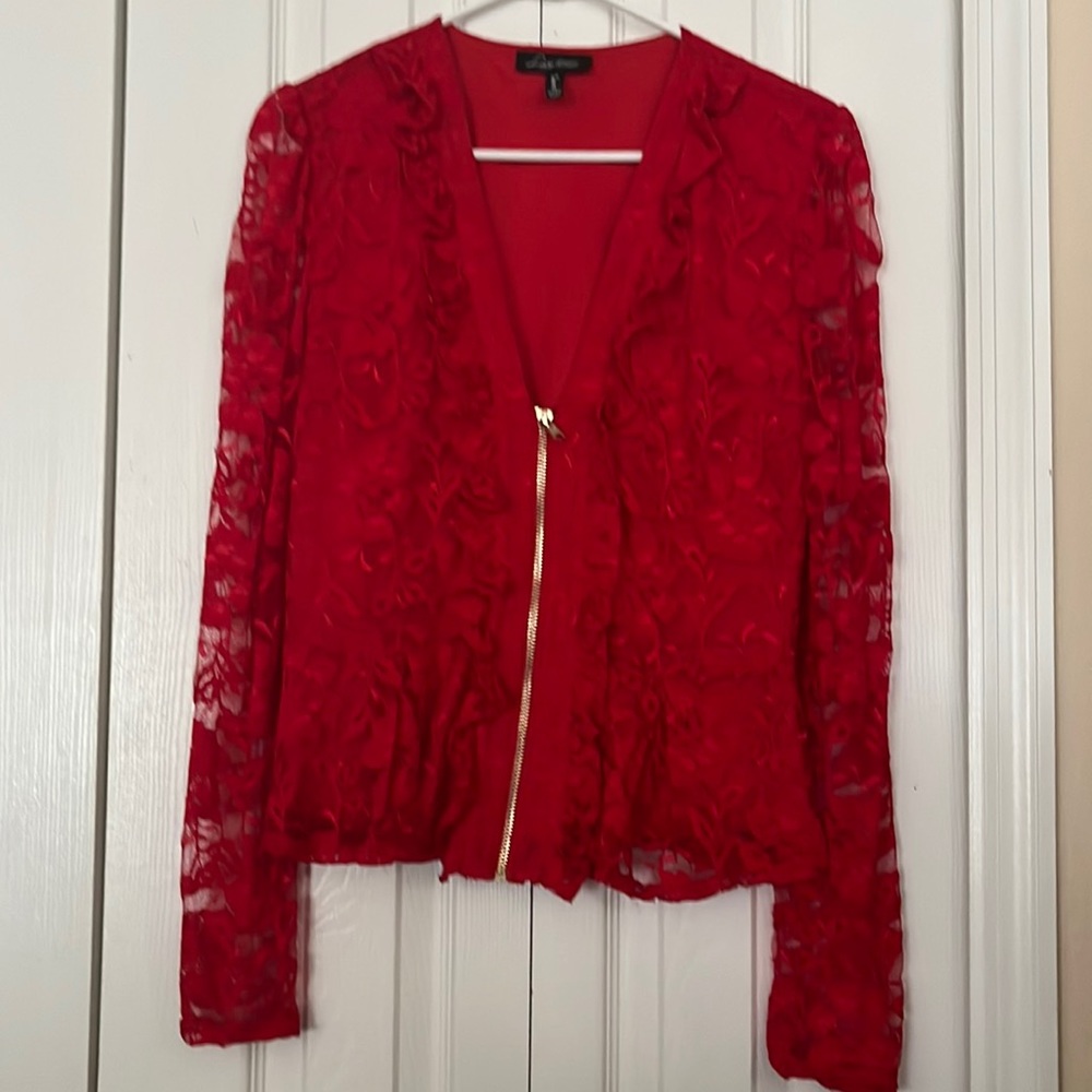 A red spandex blouse very softly worn, like new